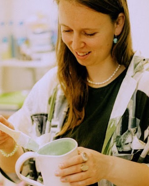 Anna Bestuzheva with a finished handmade mug